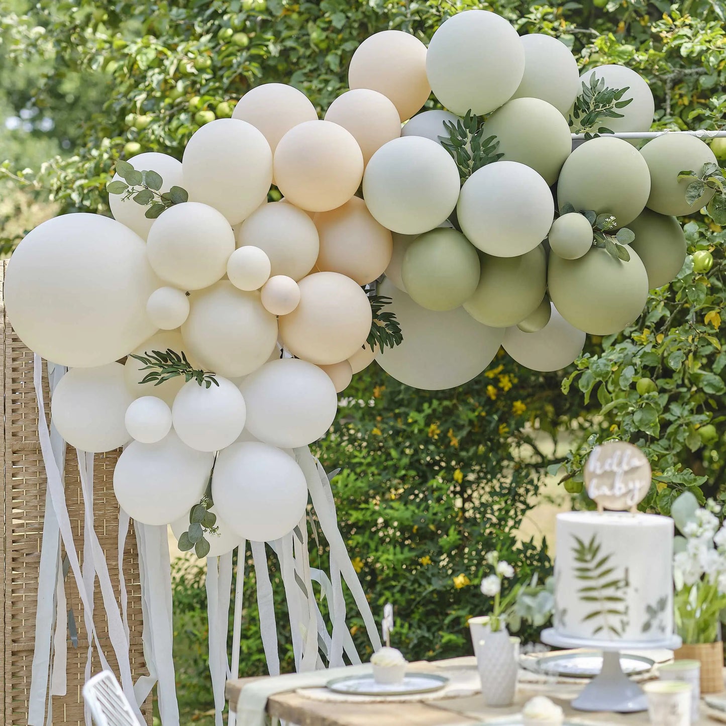 Botanical balloon arch with eucalyptus and sage leaves and streamers Ginger Ray