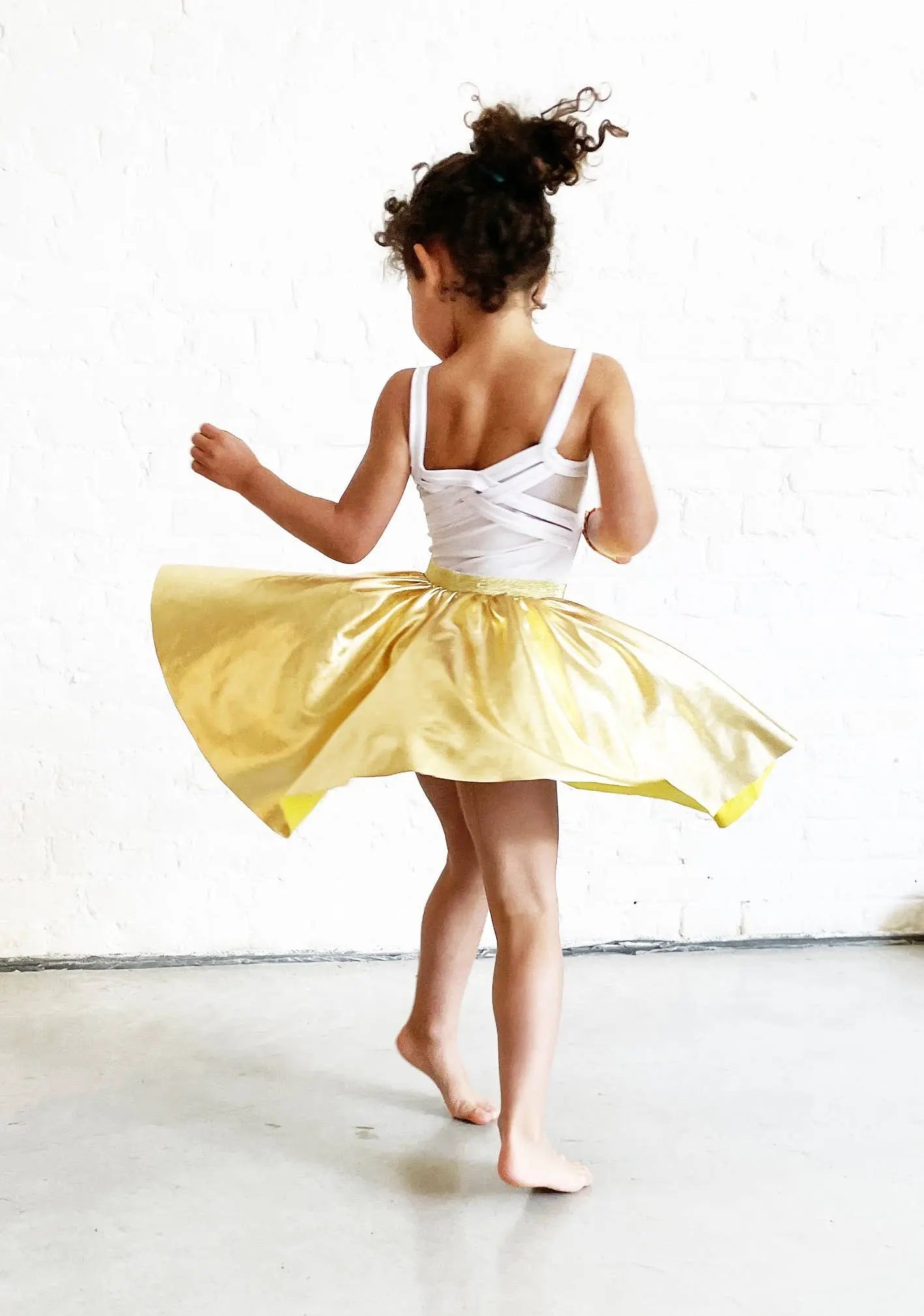 Ratatam! - The metallic gold elastic skirt that turns you Ratatam